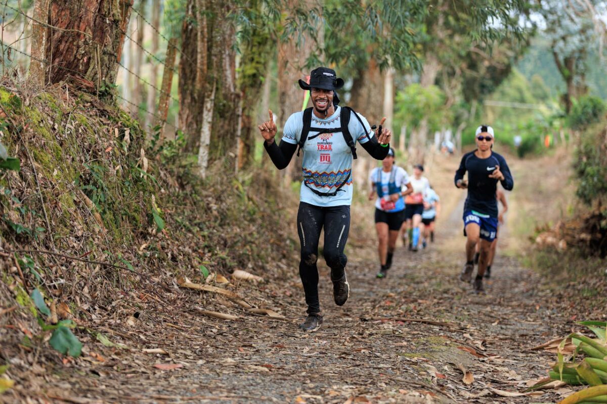 Trail runners racing through a forest path, enjoying the natural setting and camaraderie.